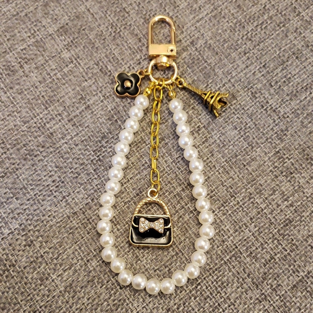 Chic Pearl and Gold Bag Charm Keychain with Black Accents